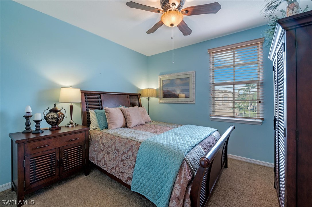 4032 Cherrybrook Loop Fort Myers, FL 33966 - Photo 16 of 22 a bedroom with a bed and window