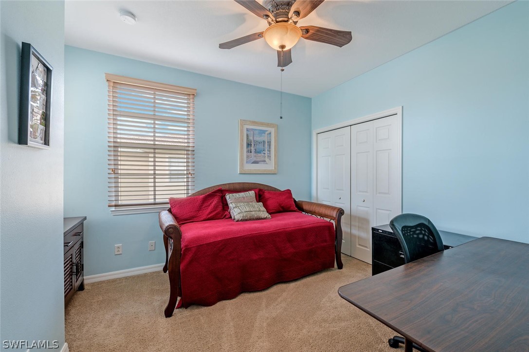 4032 Cherrybrook Loop Fort Myers, FL 33966 - Photo 19 of 22 a bedroom with two beds and a chandelier