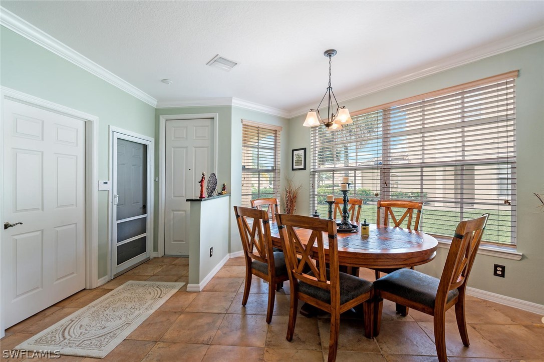 4032 Cherrybrook Loop Fort Myers, FL 33966 - Photo 2 of 22 a view of a dining room with furniture window and outside view