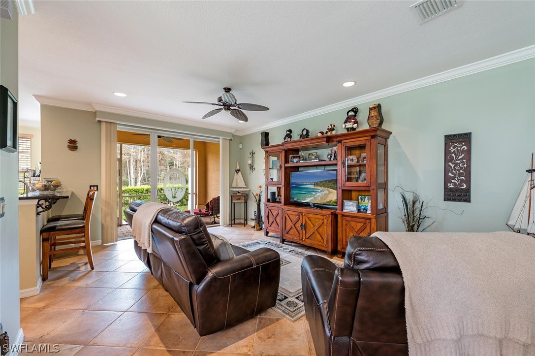 4032 Cherrybrook Loop Fort Myers, FL 33966 - Photo 3 of 22 a living room with furniture a flat screen tv and a large window
