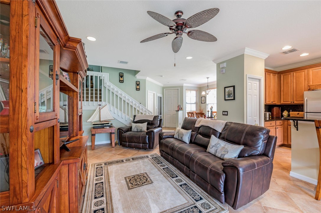 4032 Cherrybrook Loop Fort Myers, FL 33966 - Photo 5 of 22 a living room with furniture or couch and a chandelier