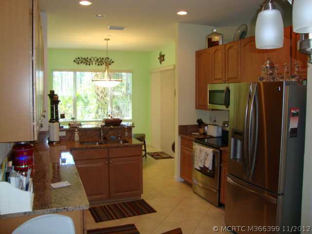 Kitchen. Beautiful kitchen. The tile on an angle, solid 42" cabinets, last year new appliances, and granite tops. The eat-in area is just to the front of this picture.