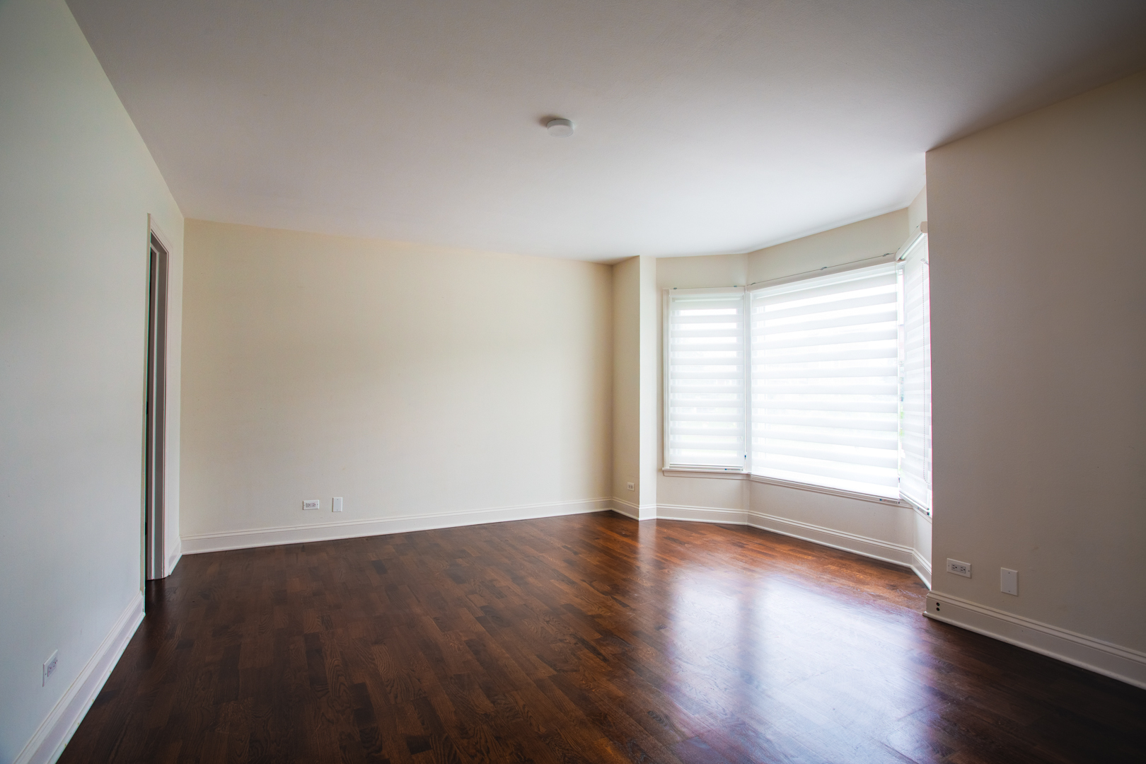 2400 Archbury Lane, Unit 1E Park Ridge, IL 60068 - Photo 13 of 18 wooden floor in an empty room with a window