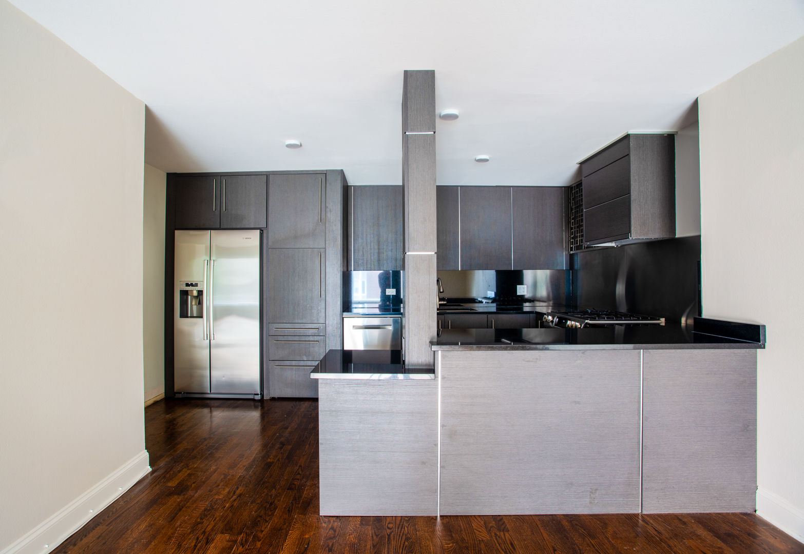 2400 Archbury Lane, Unit 1E Park Ridge, IL 60068 - Photo 5 of 18 a kitchen with stainless steel appliances a refrigerator and a stove top oven