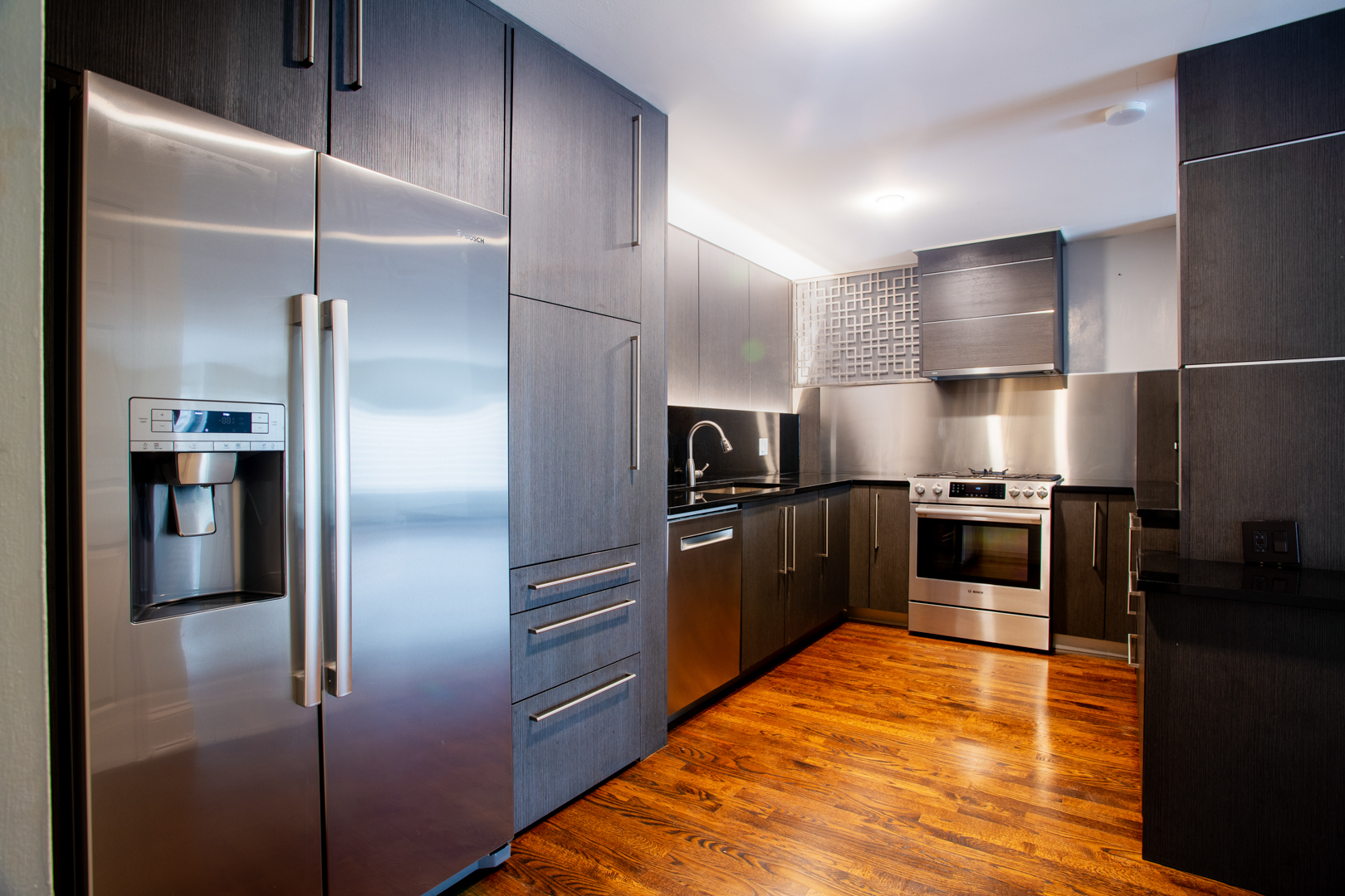 2400 Archbury Lane, Unit 1E Park Ridge, IL 60068 - Photo 7 of 18 a kitchen with kitchen island a counter top space cabinets and stainless steel appliances