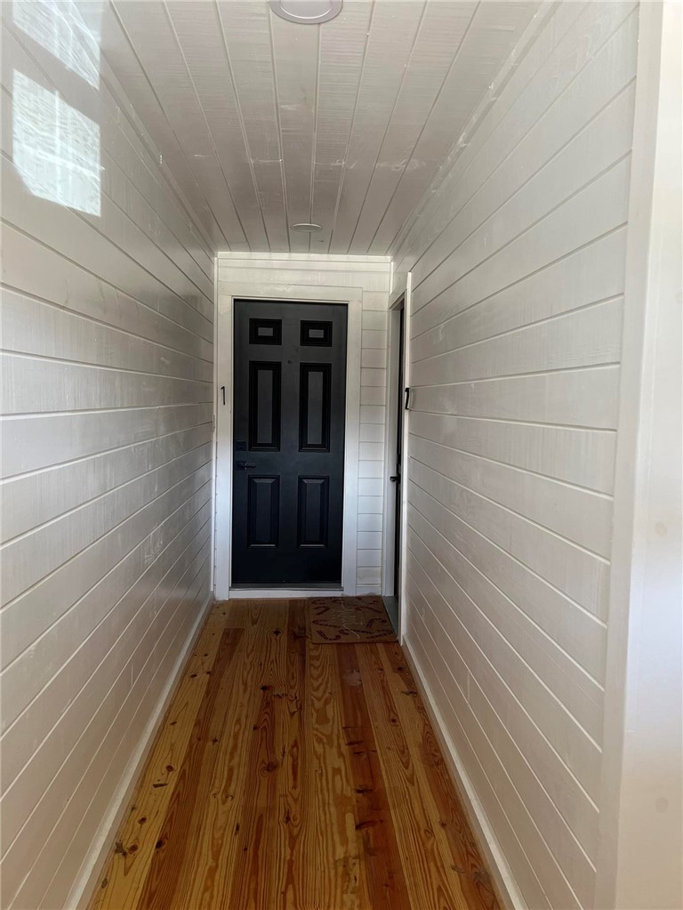 4501 College Main Street, Unit 1 Bryan, TX 77801 - Photo 2 of 8 a view of a hallway with wooden floor