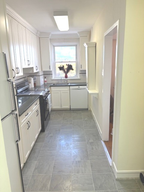 1585 Ridge Avenue, Unit 608 Evanston, IL 60201 - Photo 8 of 15 a kitchen with a sink stove and cabinets