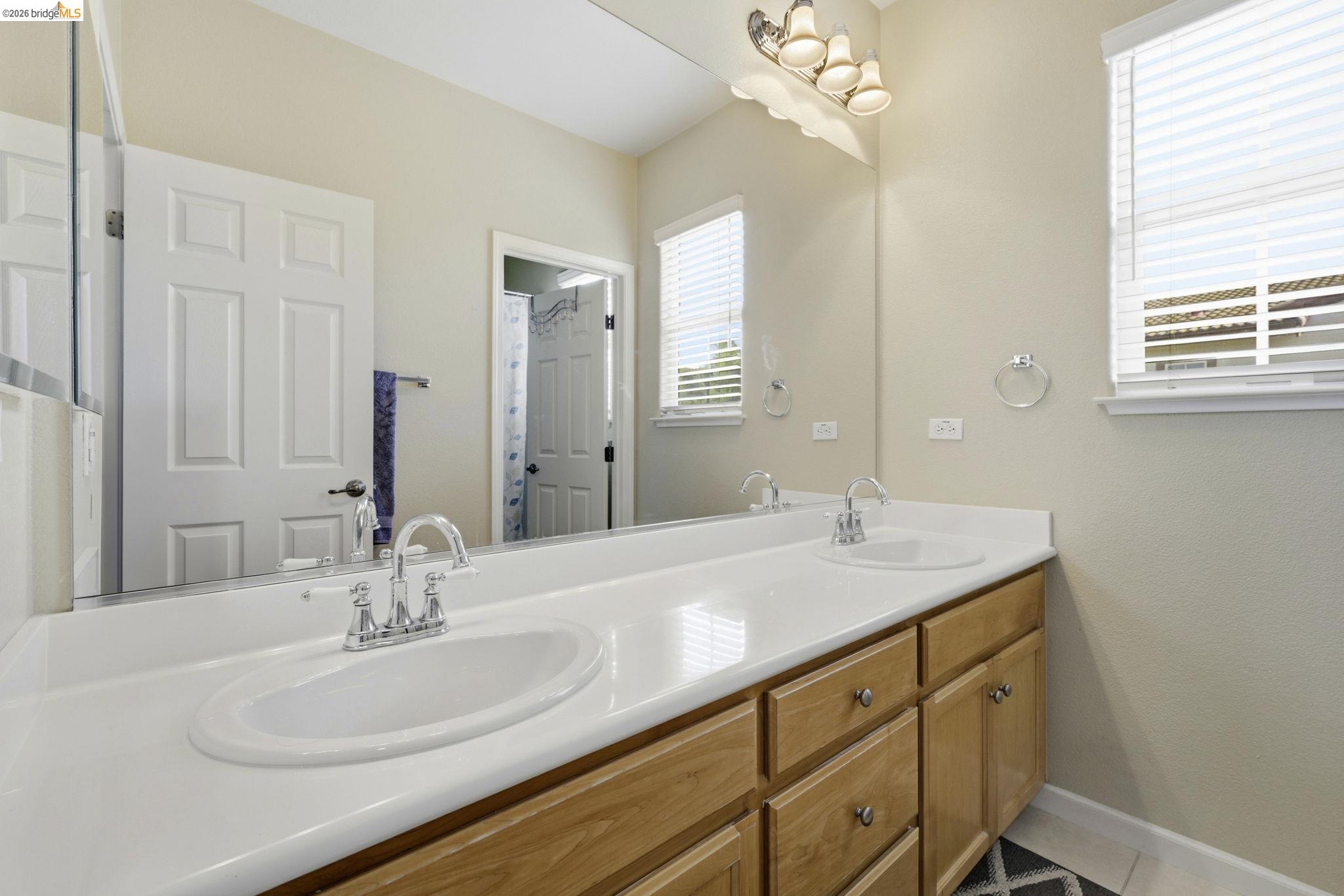 4568 Le Conte Circle Antioch, CA 94531 - Photo 11 of 36 Bathroom featuring double vanity and baseboards