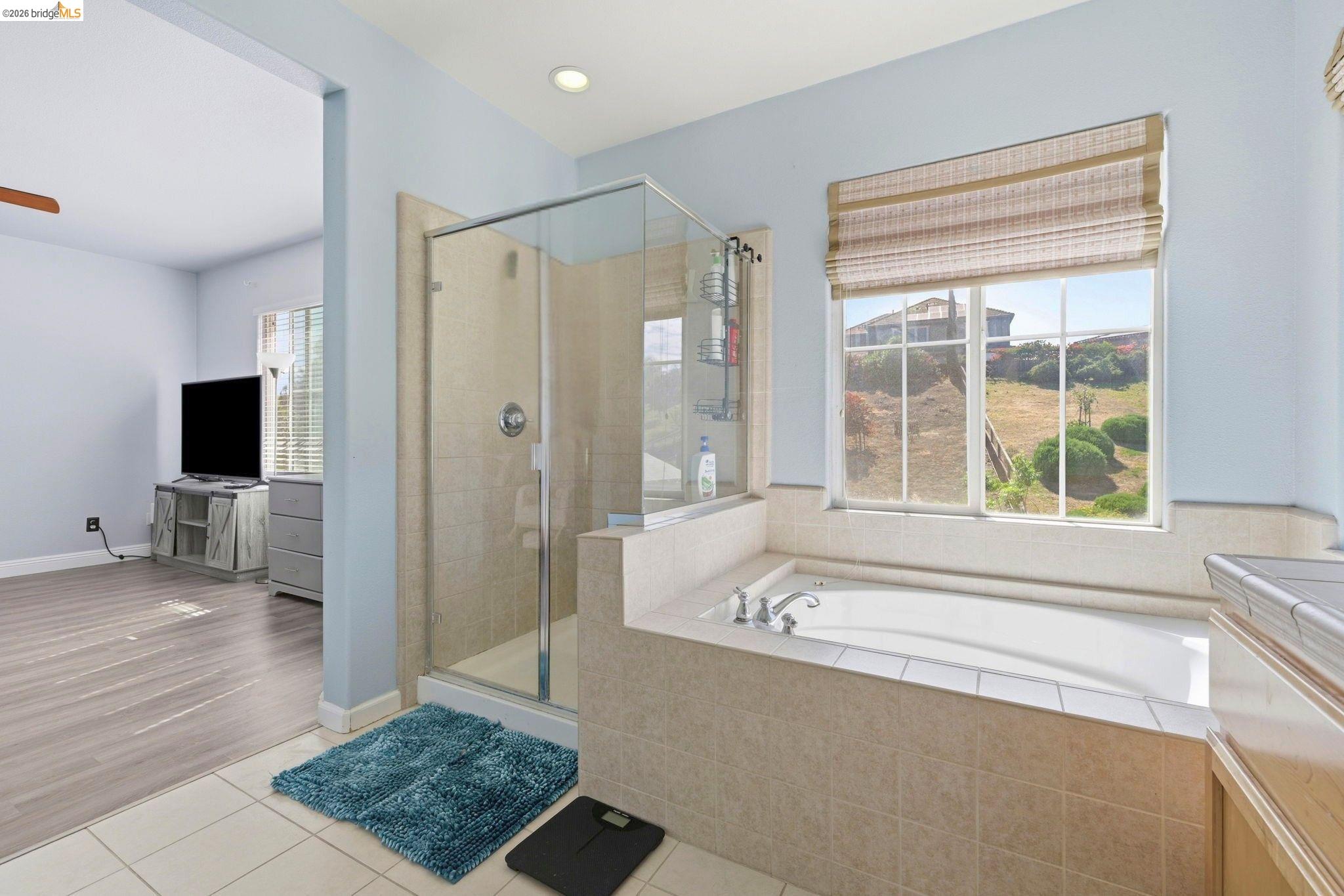 4568 Le Conte Circle Antioch, CA 94531 - Photo 12 of 36 Bathroom with light tile patterned flooring, a shower stall, a bath, vanity, and recessed lighting