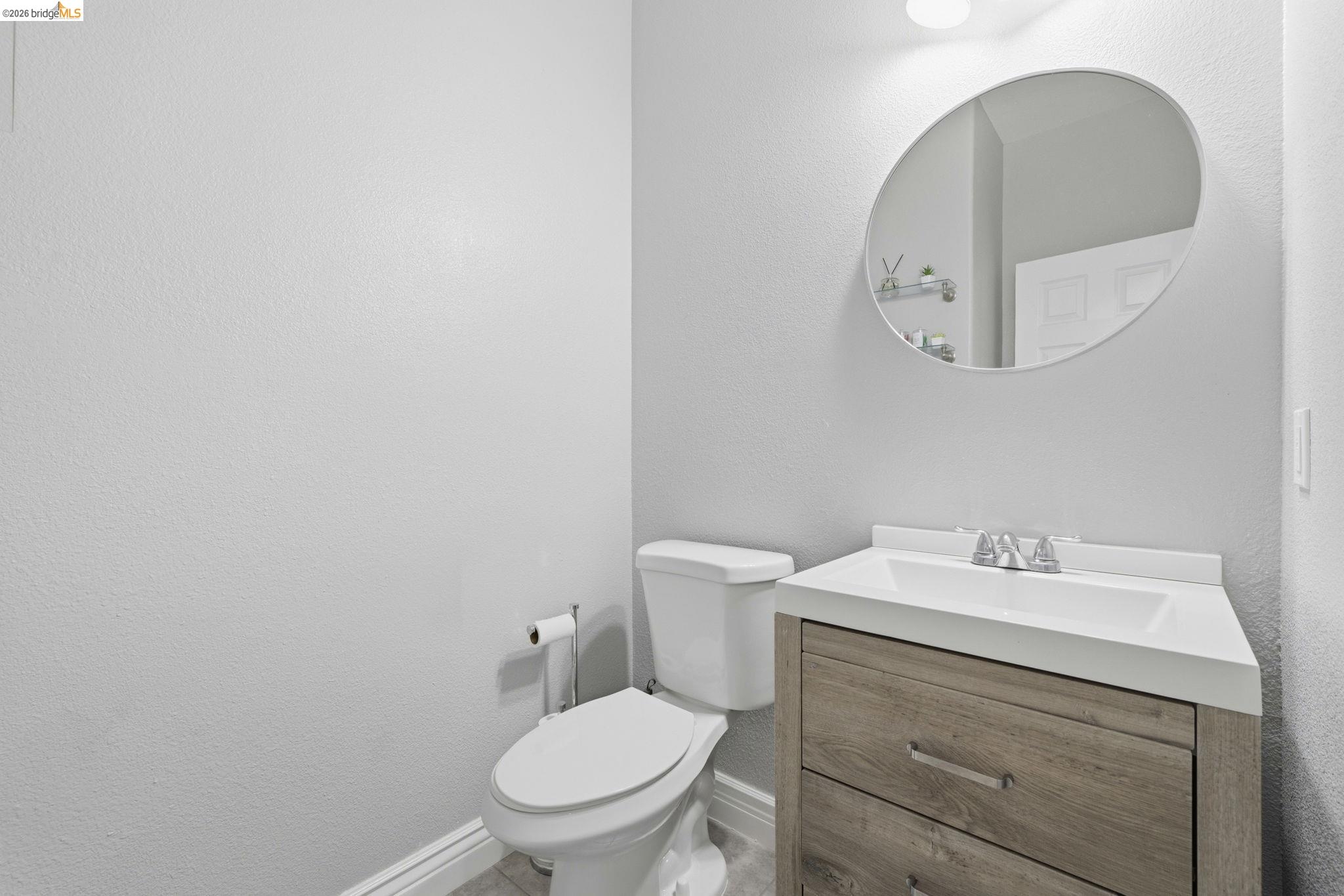 4568 Le Conte Circle Antioch, CA 94531 - Photo 14 of 36 Half bath featuring vanity and a textured wall