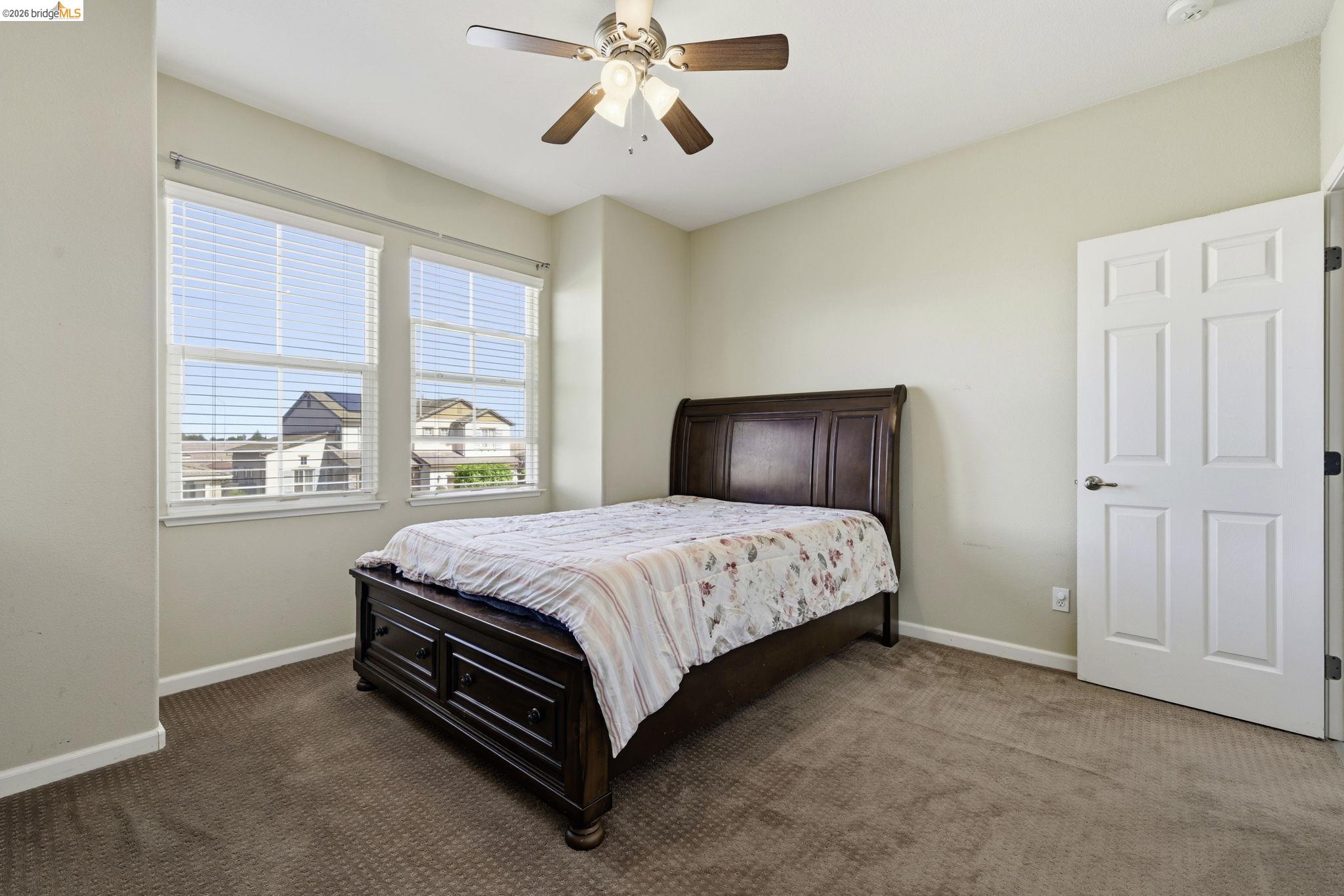 4568 Le Conte Circle Antioch, CA 94531 - Photo 19 of 36 Bedroom featuring a ceiling fan and dark colored carpet