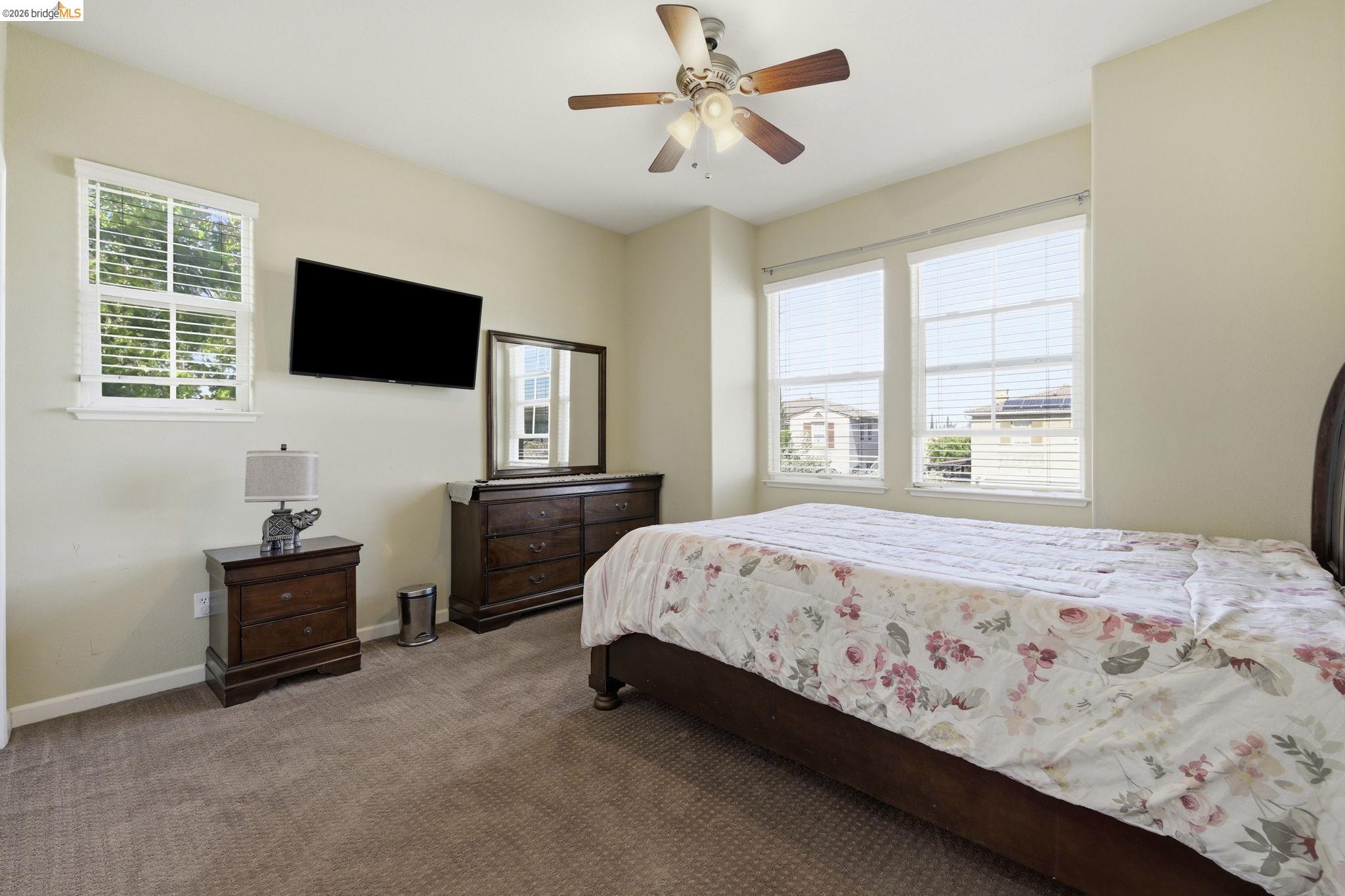 4568 Le Conte Circle Antioch, CA 94531 - Photo 20 of 36 Carpeted bedroom with ceiling fan and baseboards