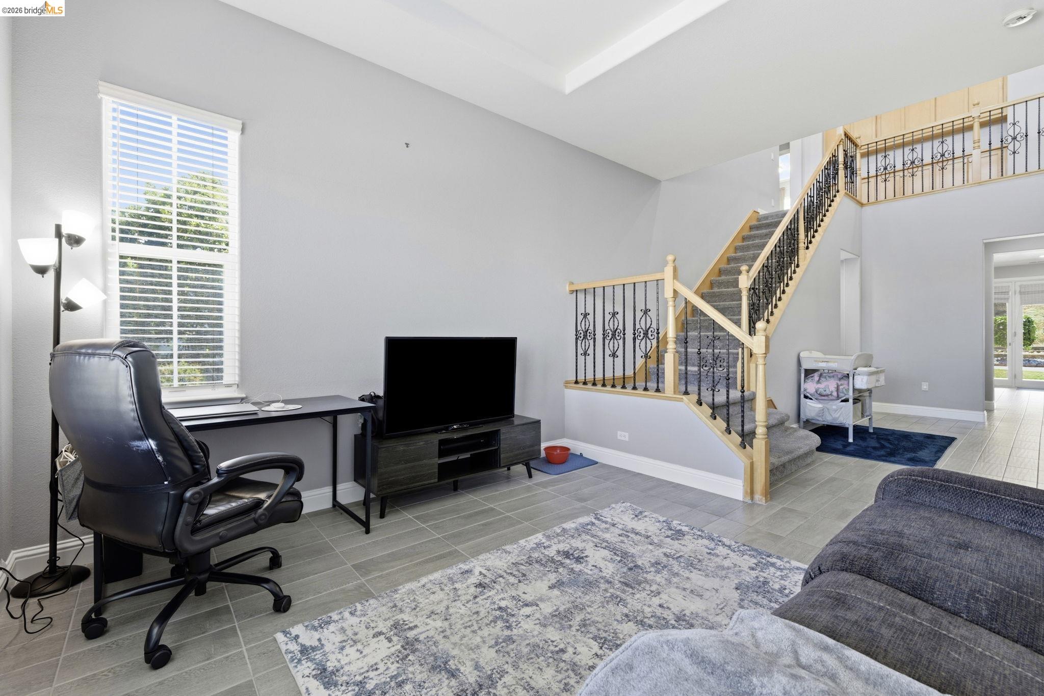 4568 Le Conte Circle Antioch, CA 94531 - Photo 30 of 36 Living room with stairway and light tile patterned floors