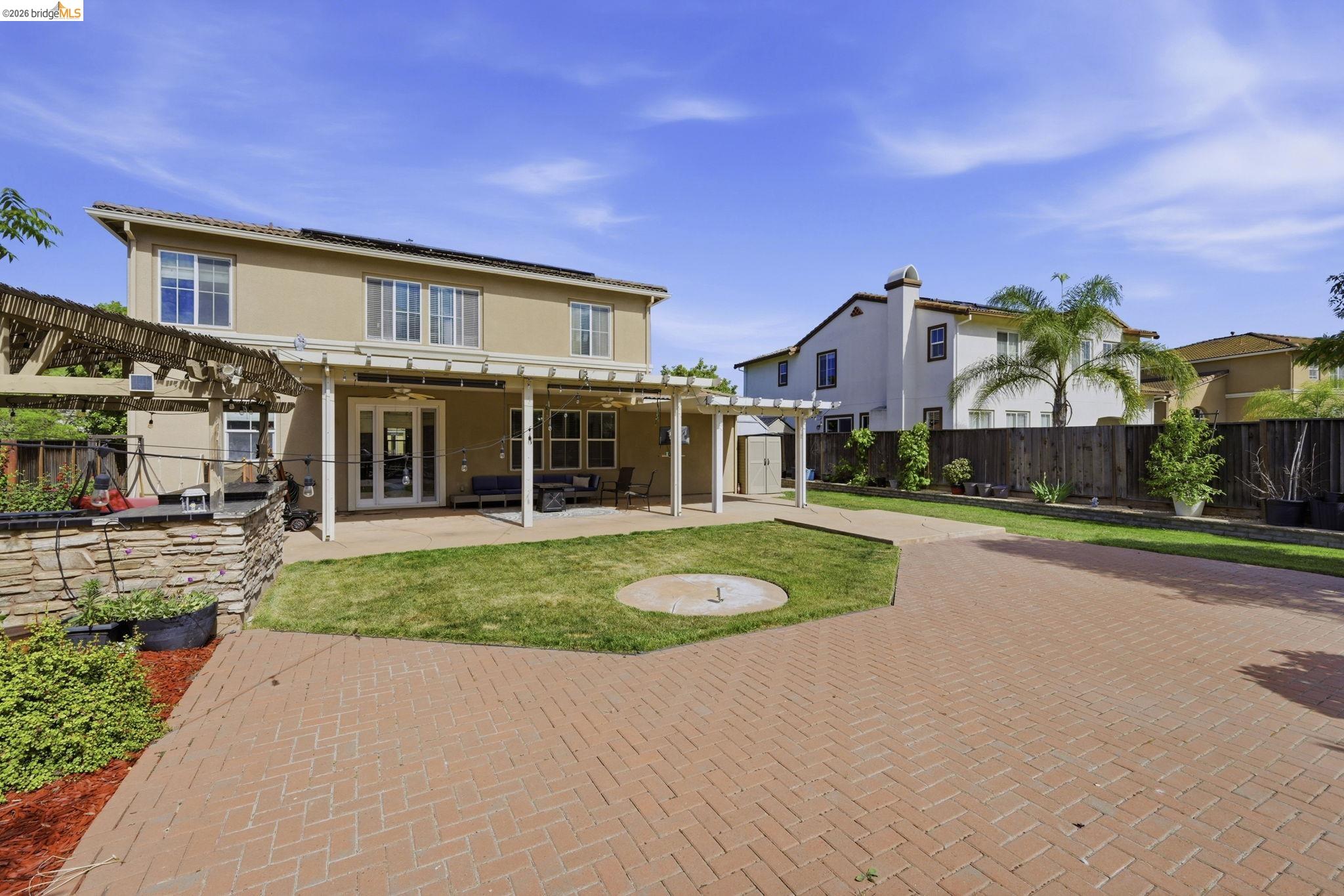 4568 Le Conte Circle Antioch, CA 94531 - Photo 6 of 36 Back of property featuring a pergola, a patio, stucco siding, french doors, and solar panels