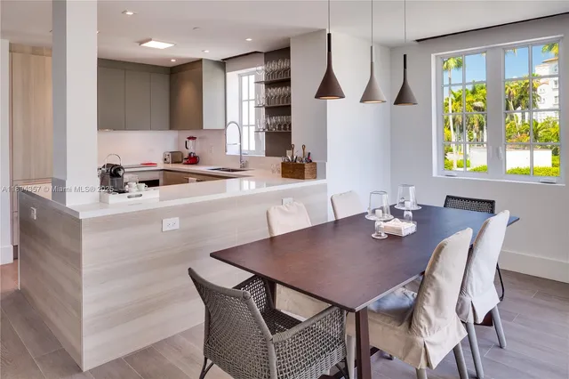 a view of a dining room with furniture and a potted plant