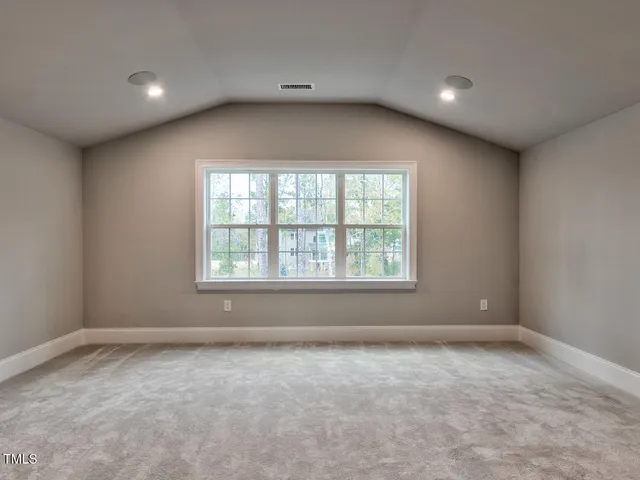a kitchen with granite countertop white cabinets and white stainless steel appliances