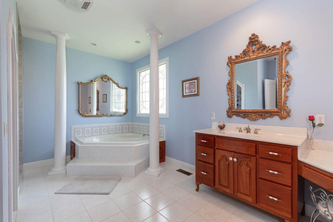 365 Normandy Road Wartrace, TN 37183 - Photo 12 of 30 a bathroom with a sink vanity mirror bathtub and a toilet