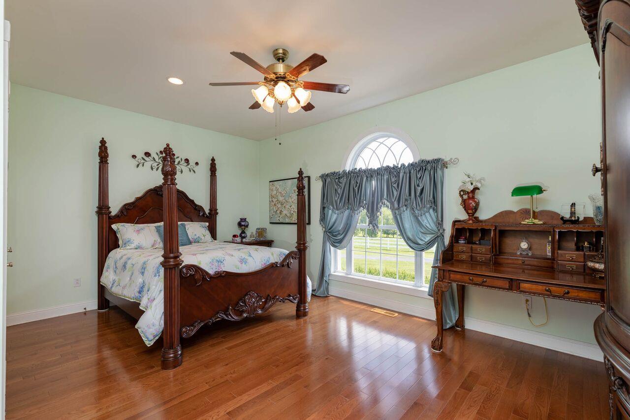 365 Normandy Road Wartrace, TN 37183 - Photo 14 of 30 a bedroom with furniture and a chandelier