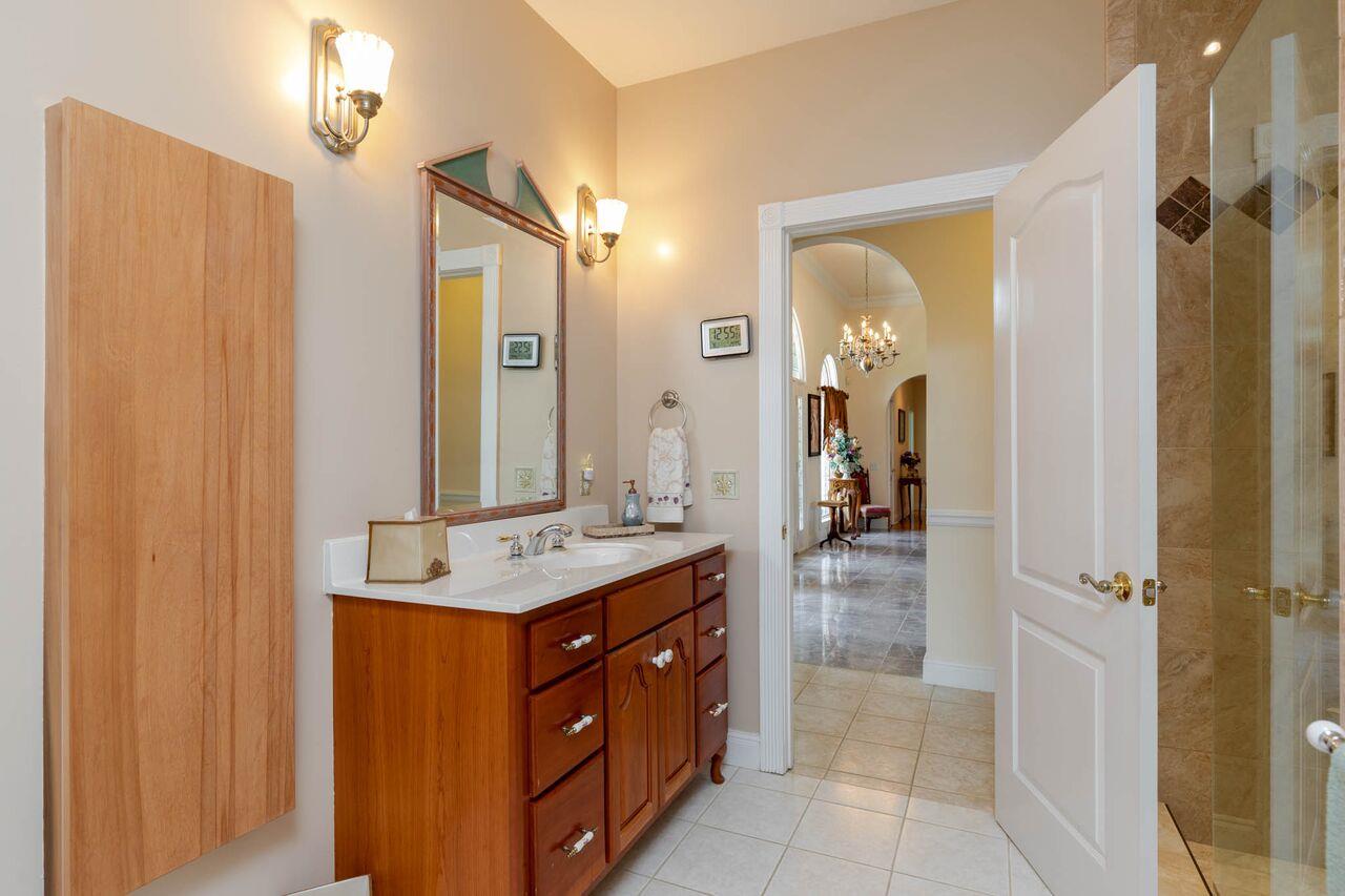 365 Normandy Road Wartrace, TN 37183 - Photo 15 of 30 a bathroom with a sink a mirror and a shower