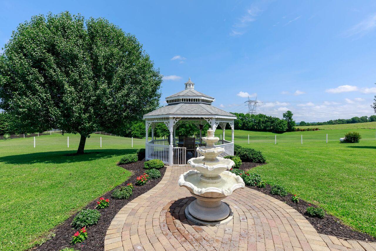 365 Normandy Road Wartrace, TN 37183 - Photo 20 of 30 a view of a house with backyard porch and garden