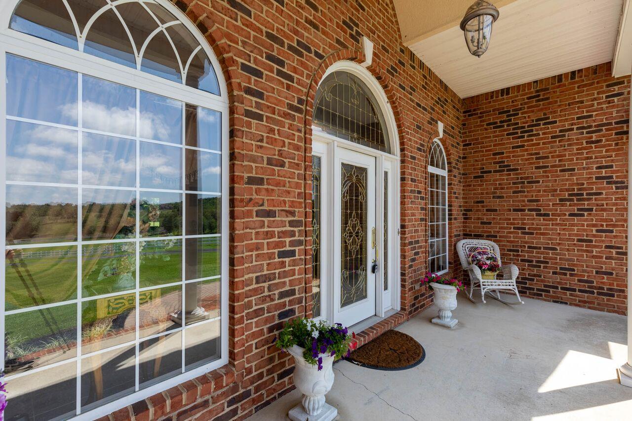 365 Normandy Road Wartrace, TN 37183 - Photo 3 of 30 a view of a balcony with chair and potted plants