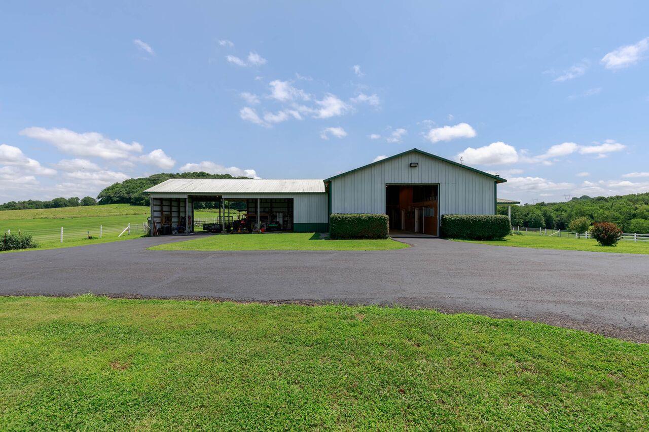 365 Normandy Road Wartrace, TN 37183 - Photo 23 of 30 a front view of a house with a yard and garage