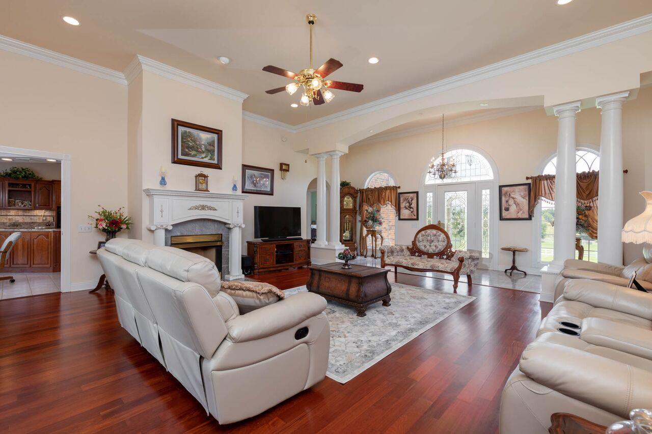 365 Normandy Road Wartrace, TN 37183 - Photo 4 of 30 a living room with furniture a fireplace and a chandelier
