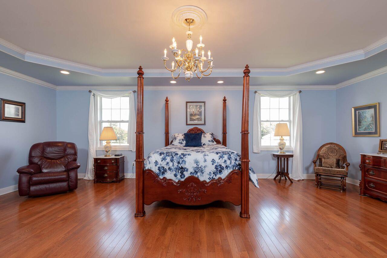 365 Normandy Road Wartrace, TN 37183 - Photo 9 of 30 a bedroom with a bed and wooden floor