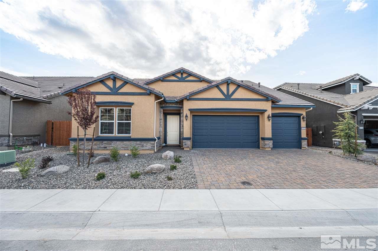 9425 Hawkshead Road, Unit HOMESITE 93 Reno, NV 89521 - Photo 1 of 11 a front view of a house with trees
