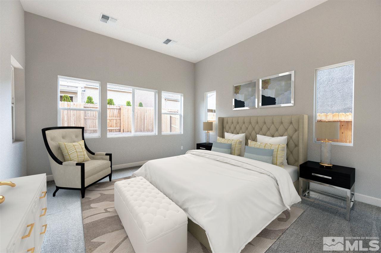 9425 Hawkshead Road, Unit HOMESITE 93 Reno, NV 89521 - Photo 9 of 11 a bedroom with a bed and a couch