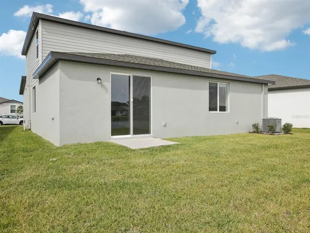 a house view with a backyard space