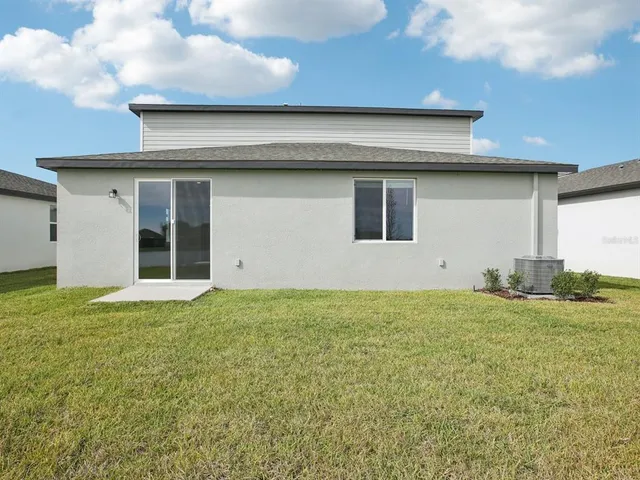 a house that has a yard in front of it