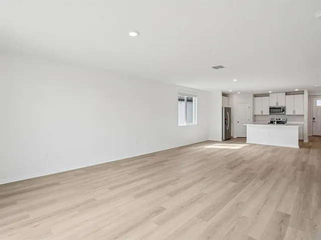 a view of a kitchen with a sink and a window