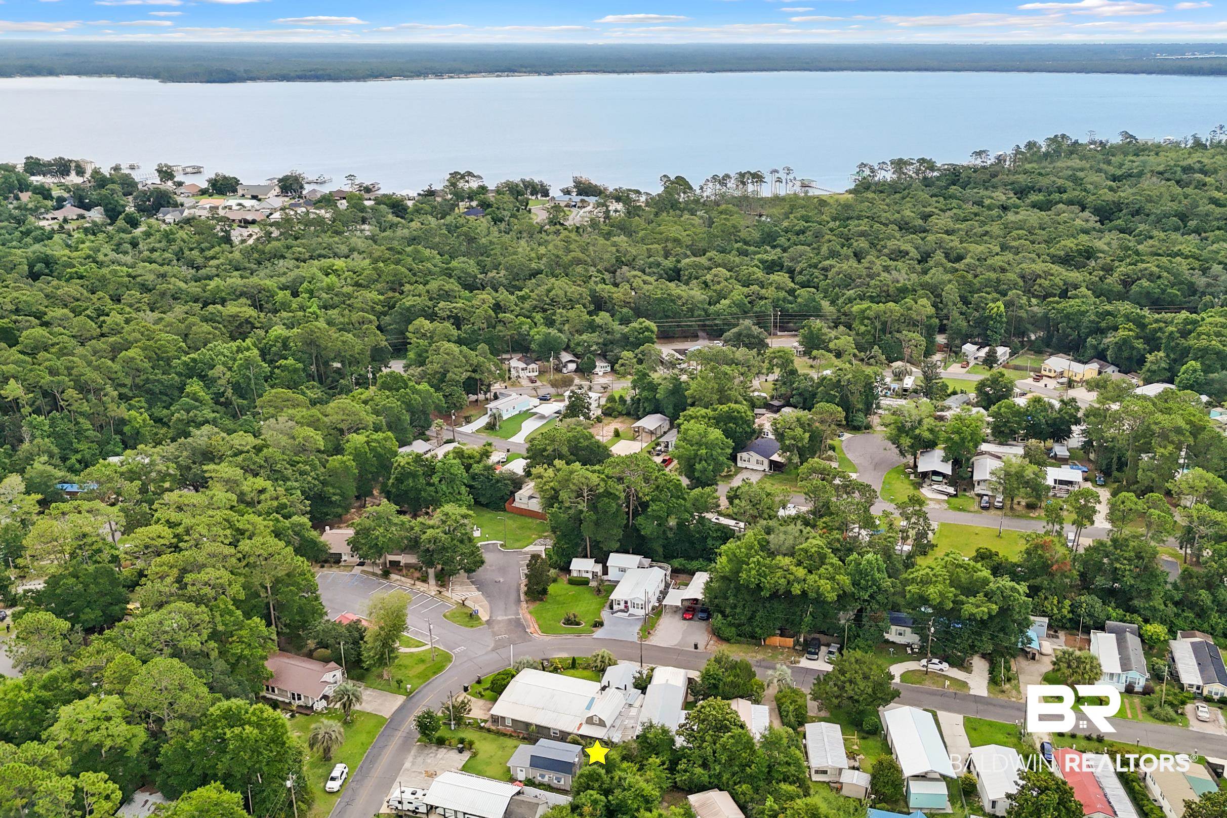 496 Elberta Loop Lillian, AL 36549 - Photo 26 of 29 Aerial perspective of suburban area featuring a nearby body of water