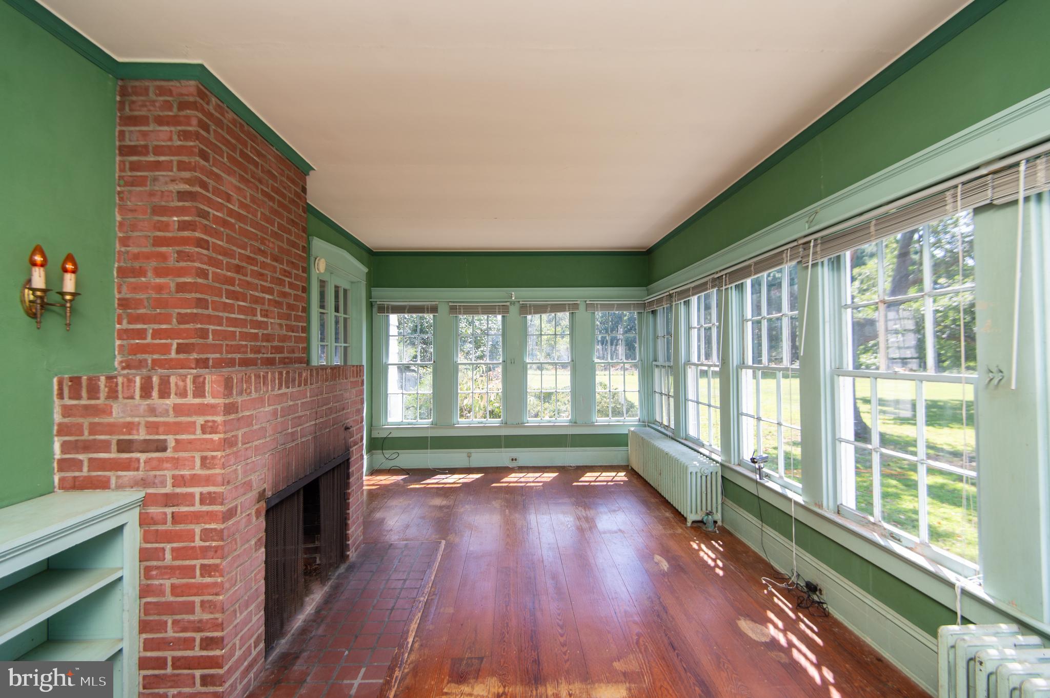 4910 Gregory Road Cambridge, MD 21613 - Photo 15 of 131 2nd brick fireplace
