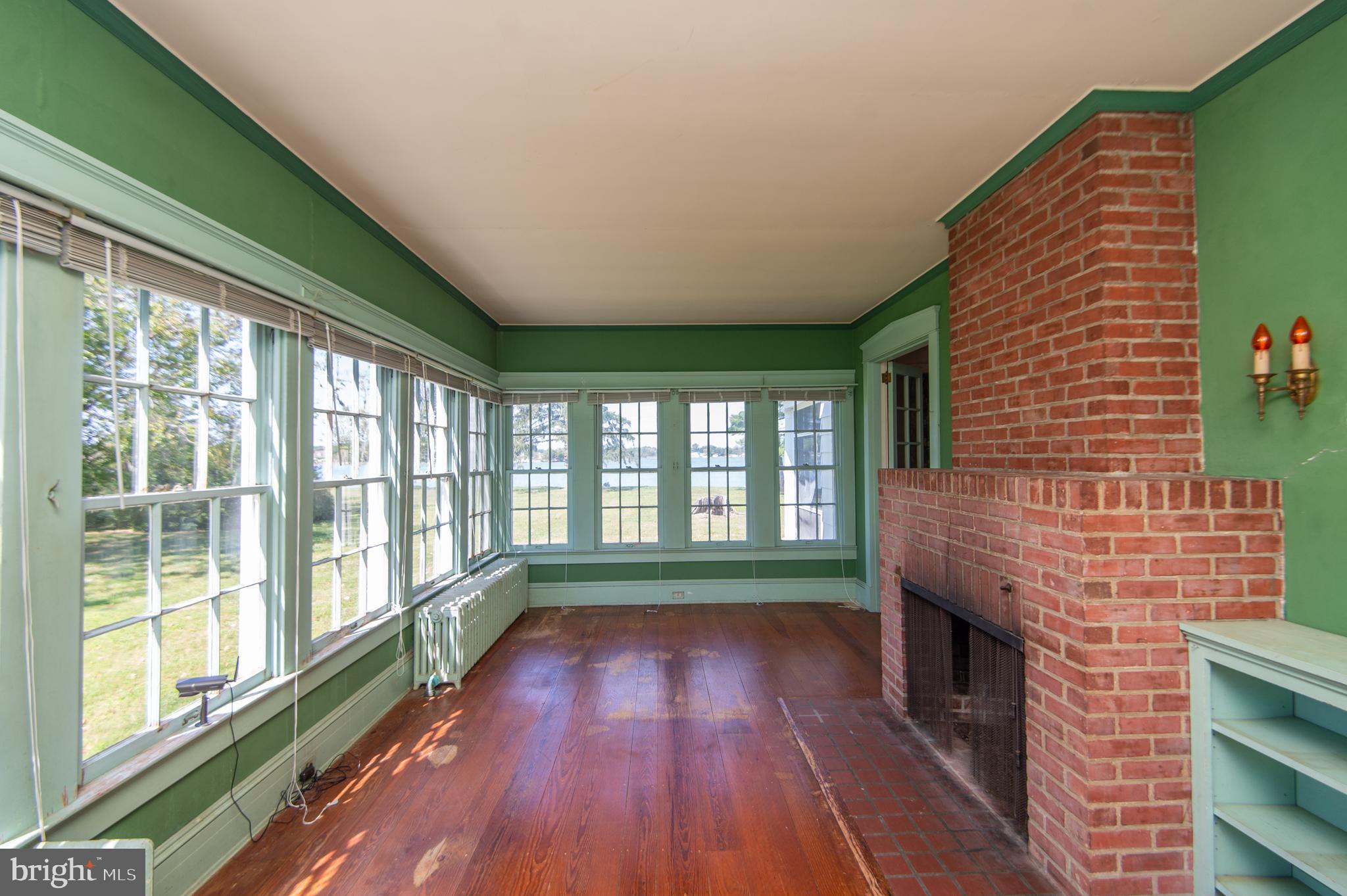 4910 Gregory Road Cambridge, MD 21613 - Photo 17 of 131 Beautiful sunroom spans width of home