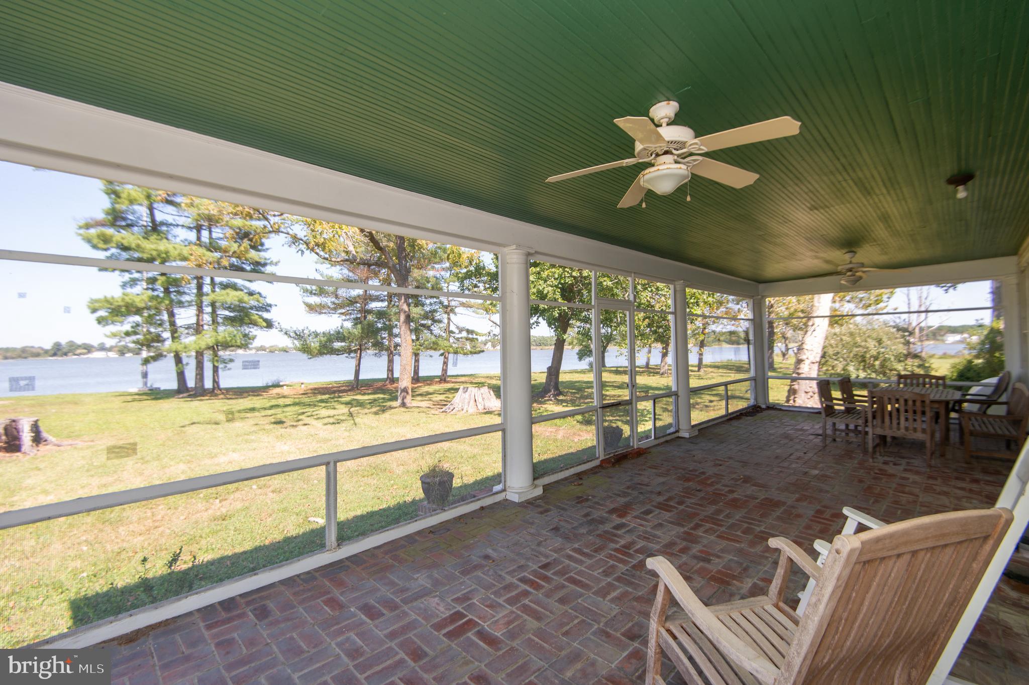 4910 Gregory Road Cambridge, MD 21613 - Photo 28 of 131 Brick Floor porch is spacious with sitting area