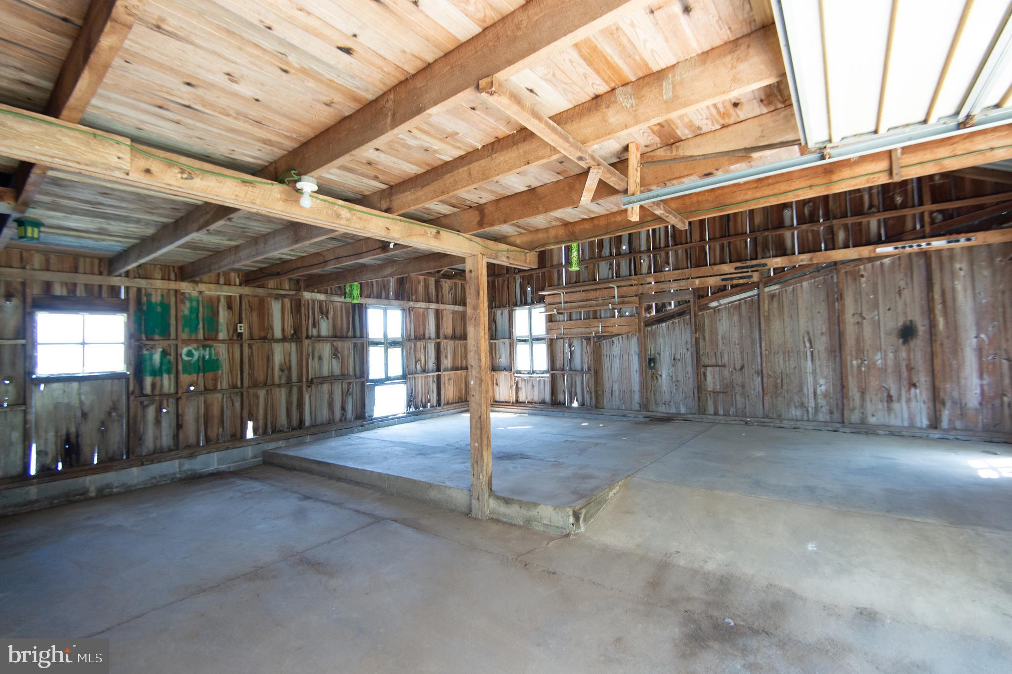 4910 Gregory Road Cambridge, MD 21613 - Photo 88 of 131 Concrete Floor with fixed stairs to 2nd floor