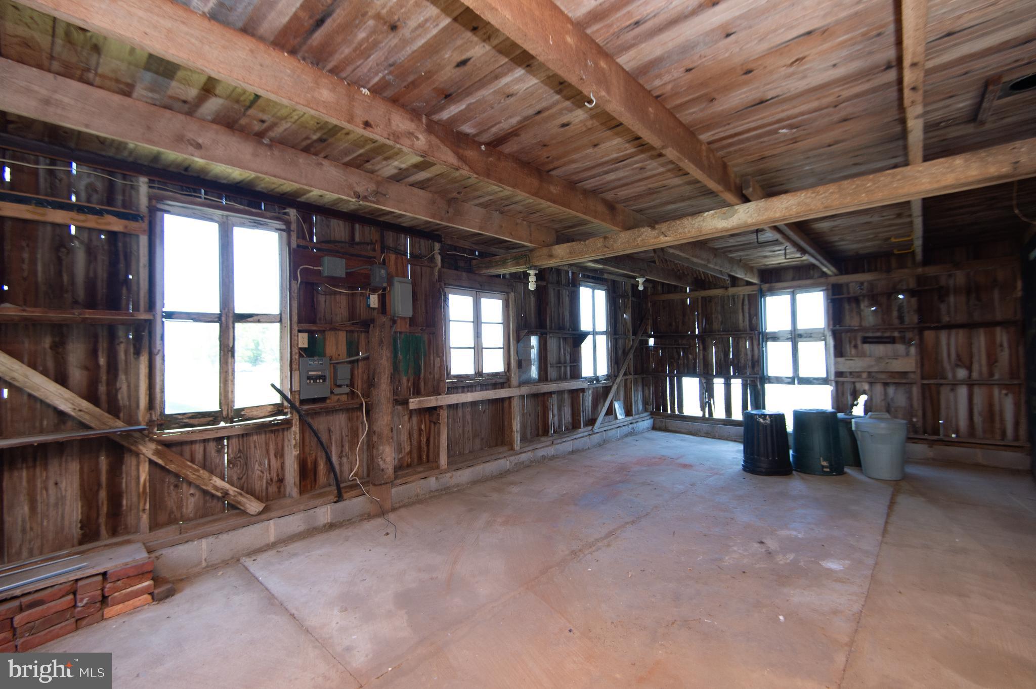 4910 Gregory Road Cambridge, MD 21613 - Photo 89 of 131 2 separate sections in barn with concrete floor