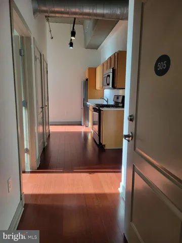 a view of a hallway with seating area
