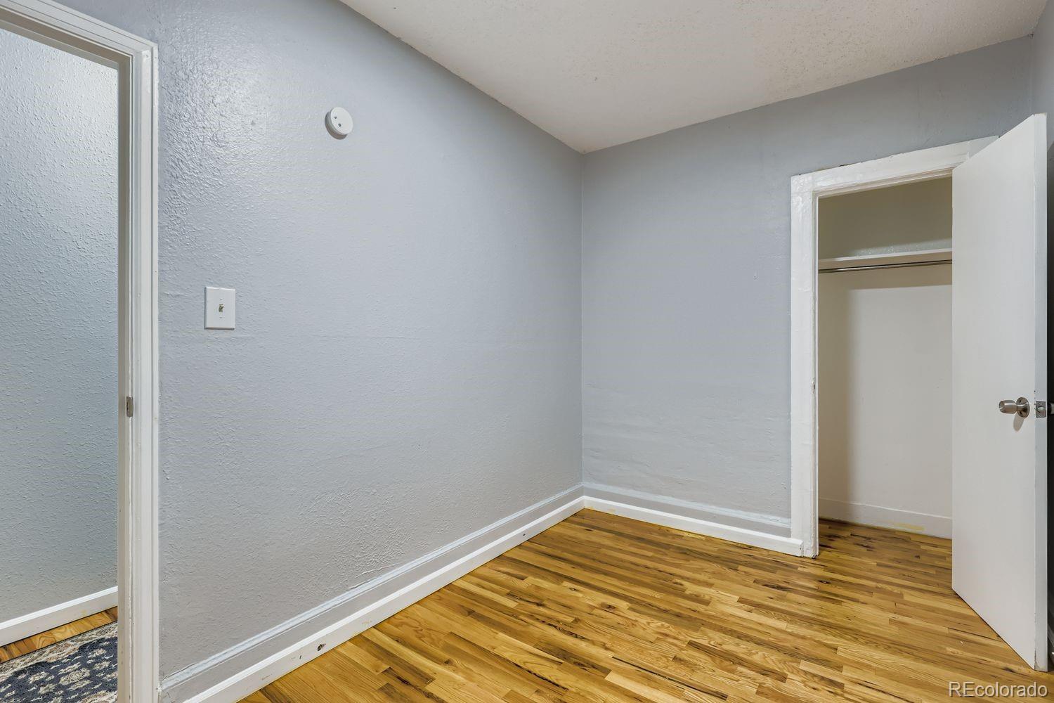 3515 North Williams Street, Unit 3517 Denver, CO 80205 - Photo 13 of 29 a view of a room with wooden floor and bathroom