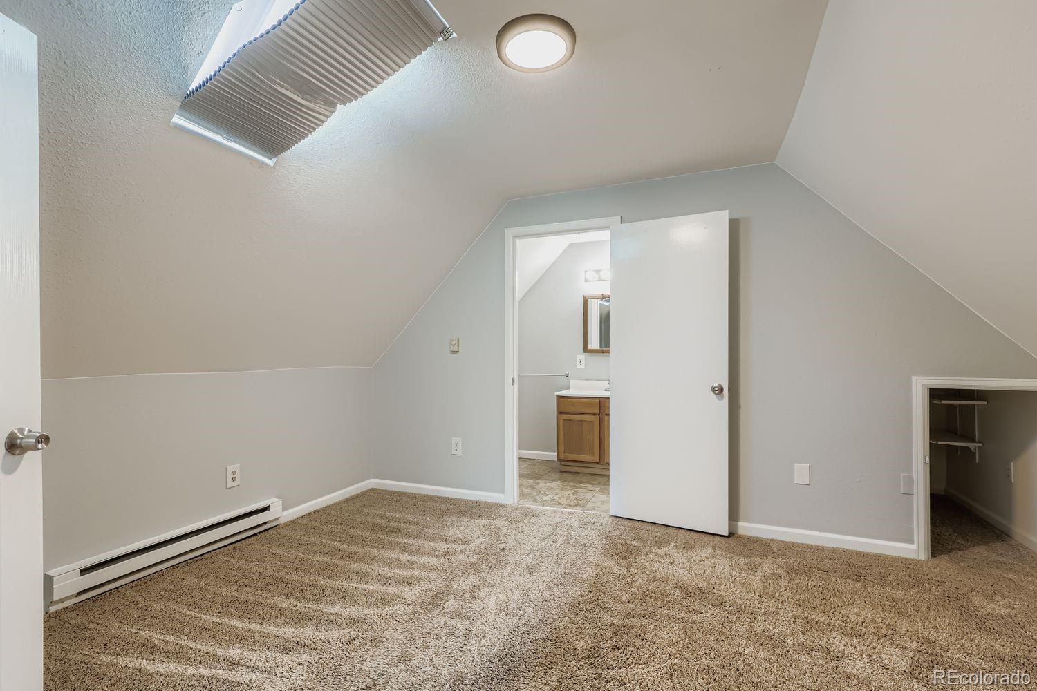 3515 North Williams Street, Unit 3517 Denver, CO 80205 - Photo 18 of 29 an empty room with an entryway and closet