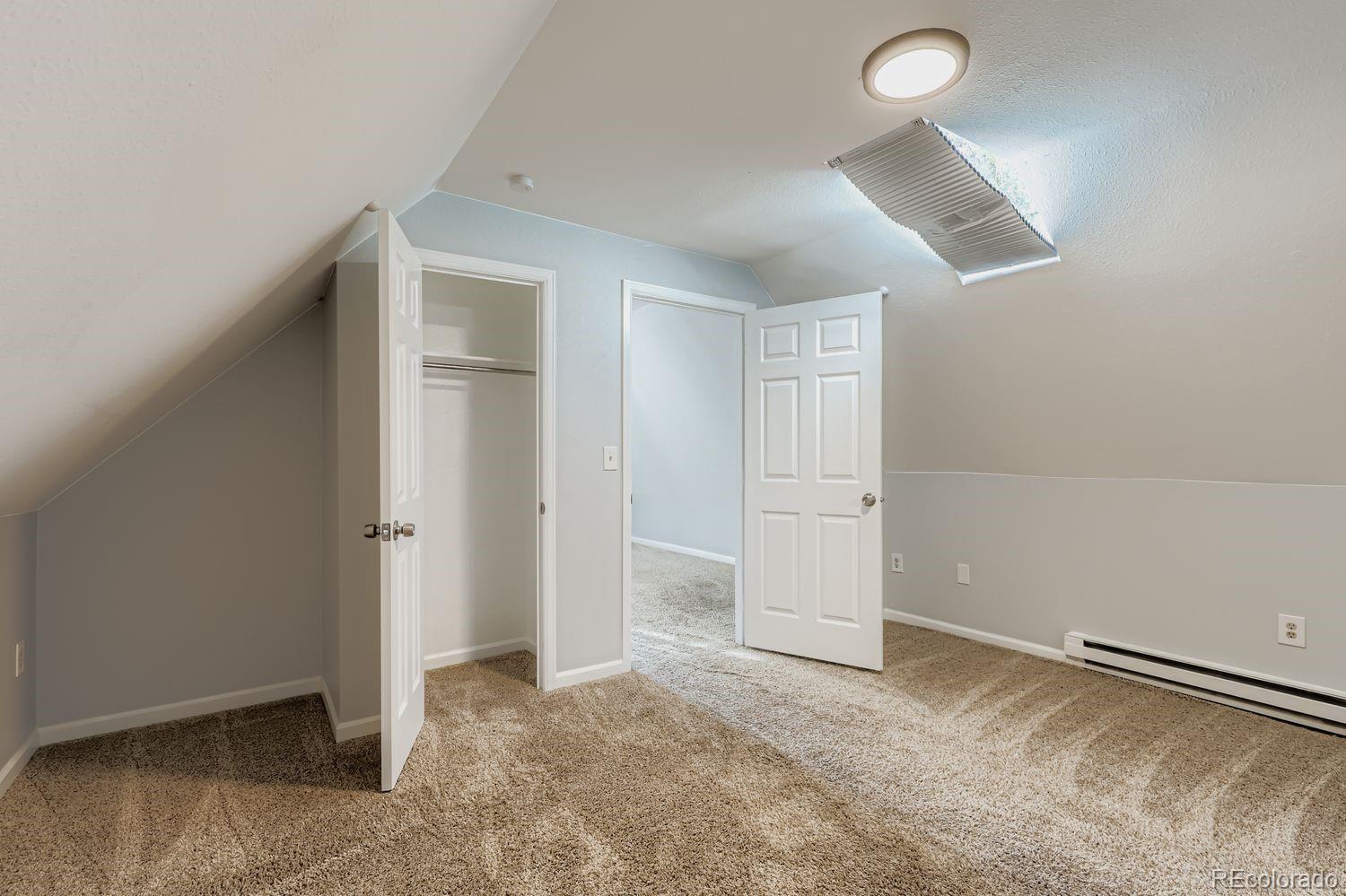 3515 North Williams Street, Unit 3517 Denver, CO 80205 - Photo 19 of 29 an empty room with closet and windows