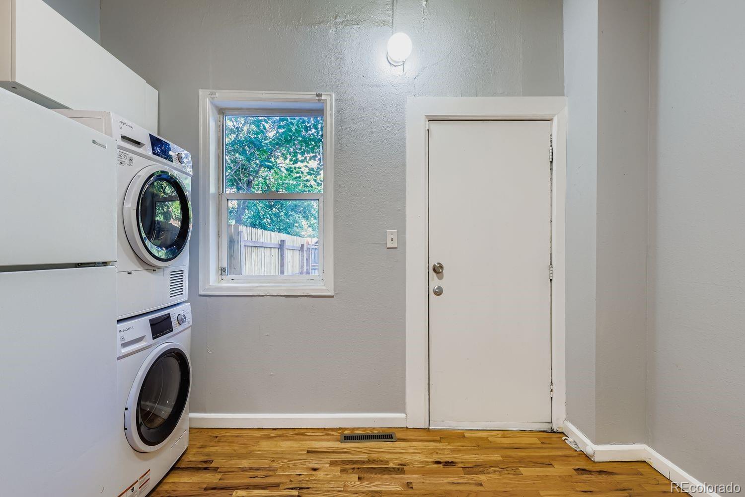 3515 North Williams Street, Unit 3517 Denver, CO 80205 - Photo 10 of 29 a view of a bedroom with washer and dryer