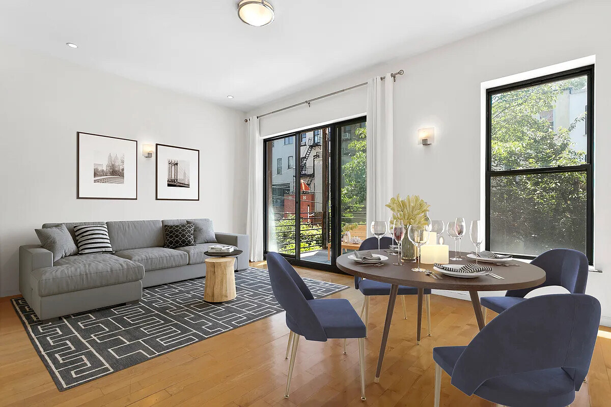 a living room with furniture and large window