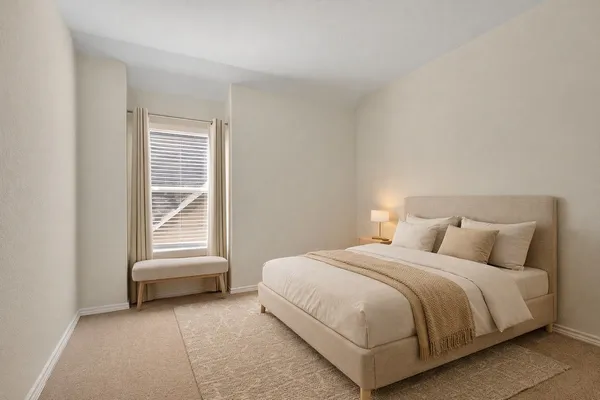 a bathroom with a granite countertop sink a mirror and a bathtub