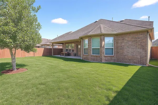a front view of a house with a garden and porch