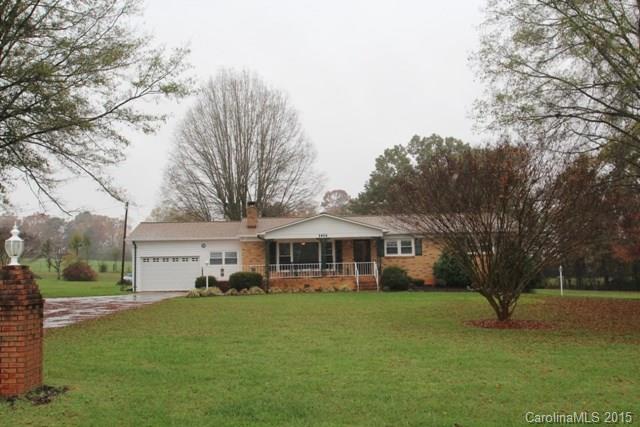 1424 Tot Dellinger Road Cherryville, NC 28021 - Photo 1 of 24 a front view of a house with a yard