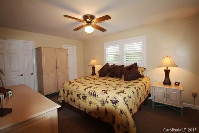 1424 Tot Dellinger Road Cherryville, NC 28021 - Photo 12 of 24 a bedroom with a bed and a chandelier