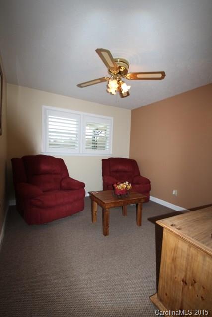 1424 Tot Dellinger Road Cherryville, NC 28021 - Photo 18 of 24 a living room with furniture and a chandelier